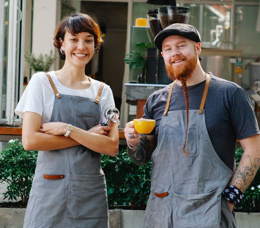a man and a woman holding a lemon