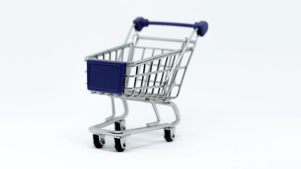 a shopping cart with a blue box