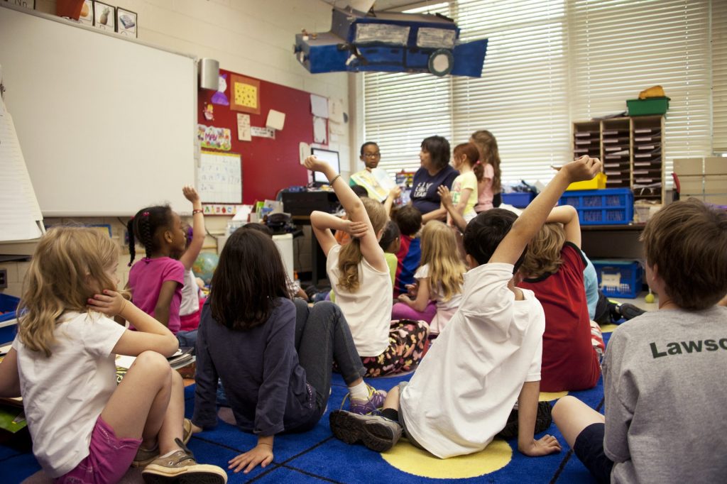 a group of children in a classroom